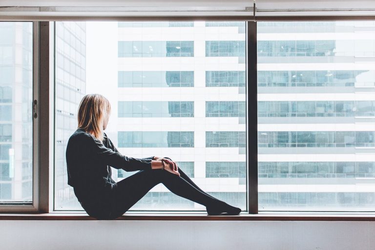 A person gazing out of a window